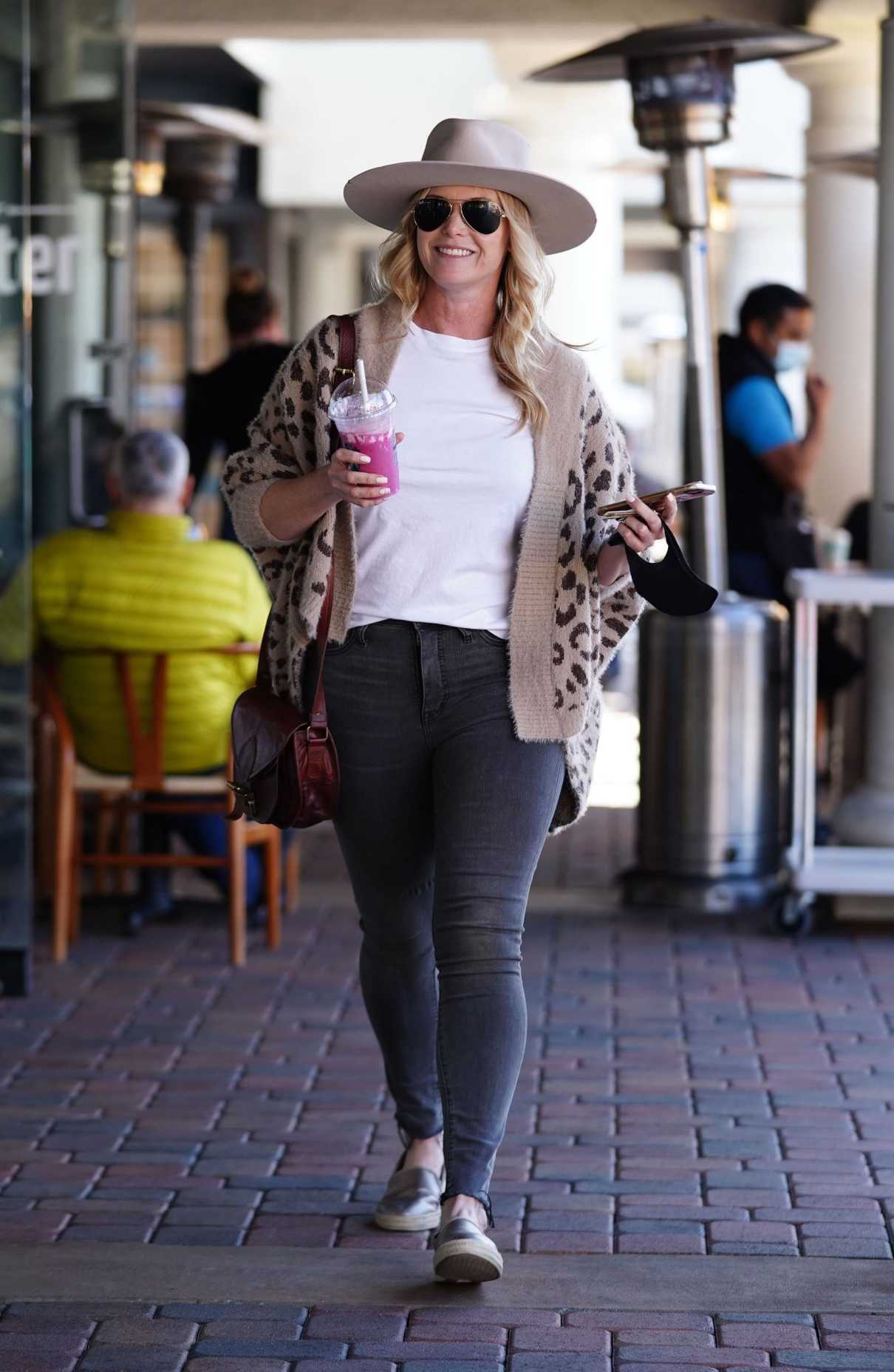 Catherine Sutherland in a Beige Hat