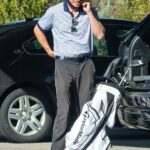 Garrett Hedlund in a Black Cap Gets Ready to Hit the Golf Course in Los Angeles 02/24/2021