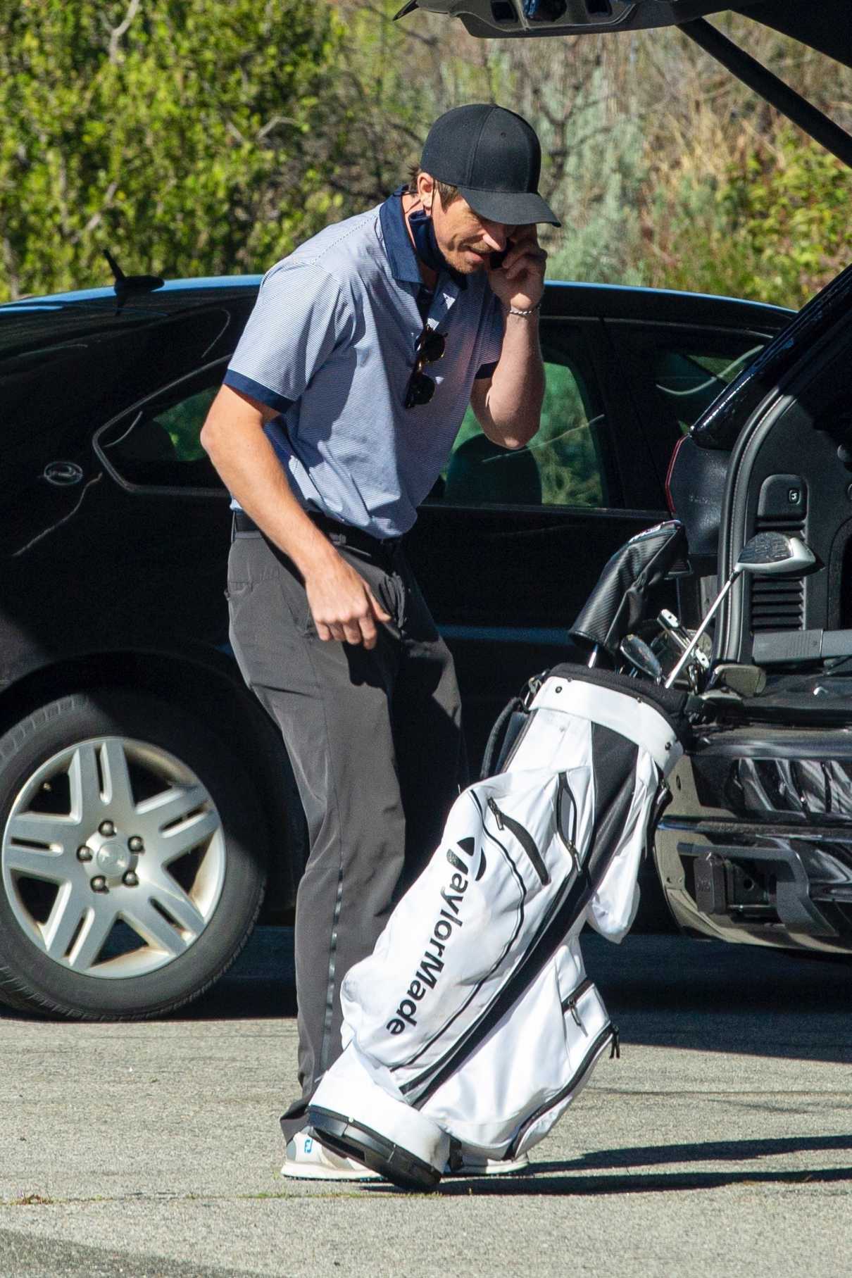 Garrett Hedlund in a Black Cap Gets Ready to Hit the Golf Course in Los