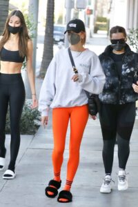 Hailey Bieber in an Orange Leggings