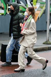 Iris Law in a Beige Suit