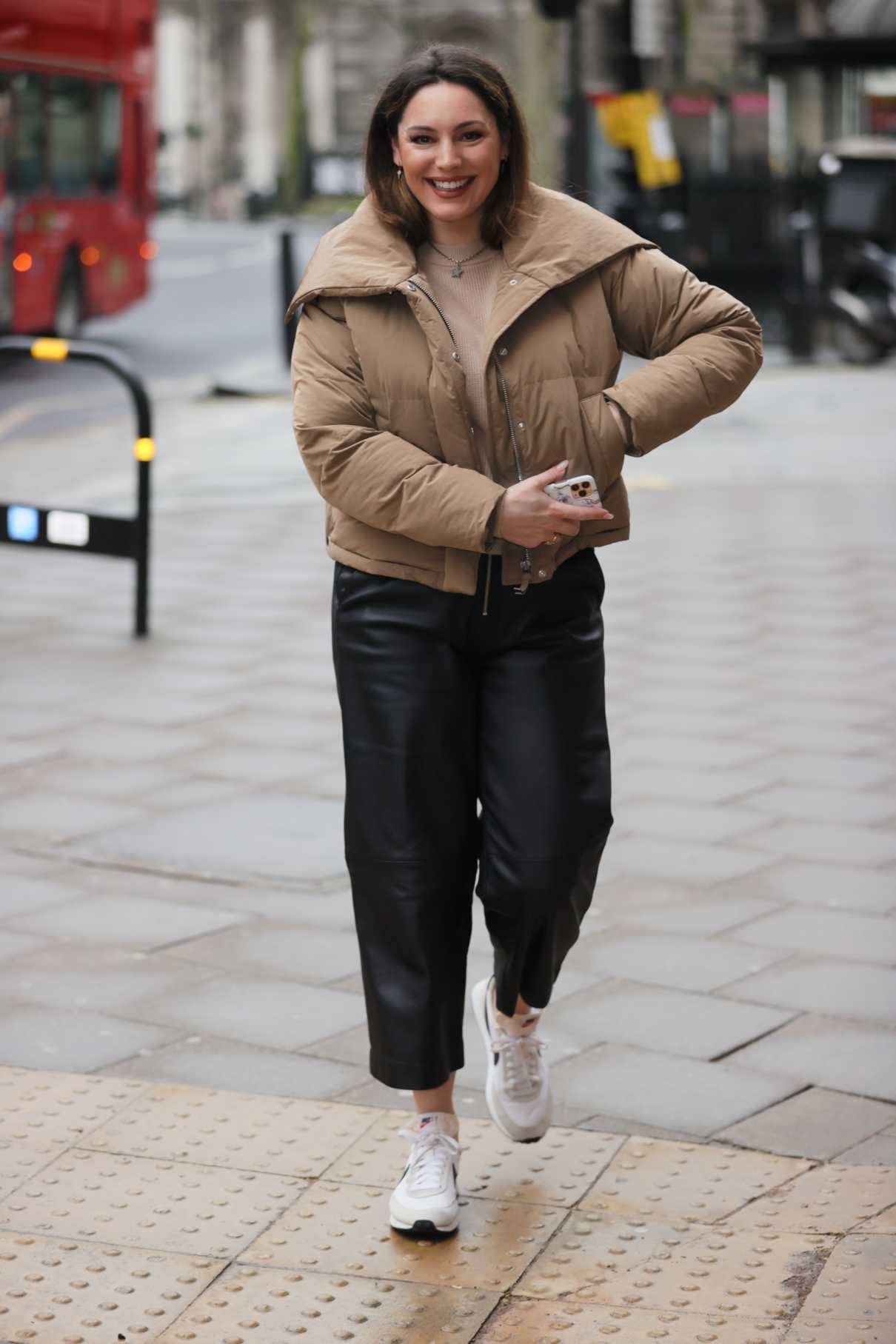 Kelly Brook in a Beige Puffer Jacket