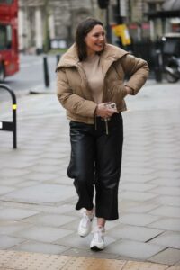 Kelly Brook in a Beige Puffer Jacket