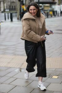 Kelly Brook in a Beige Puffer Jacket