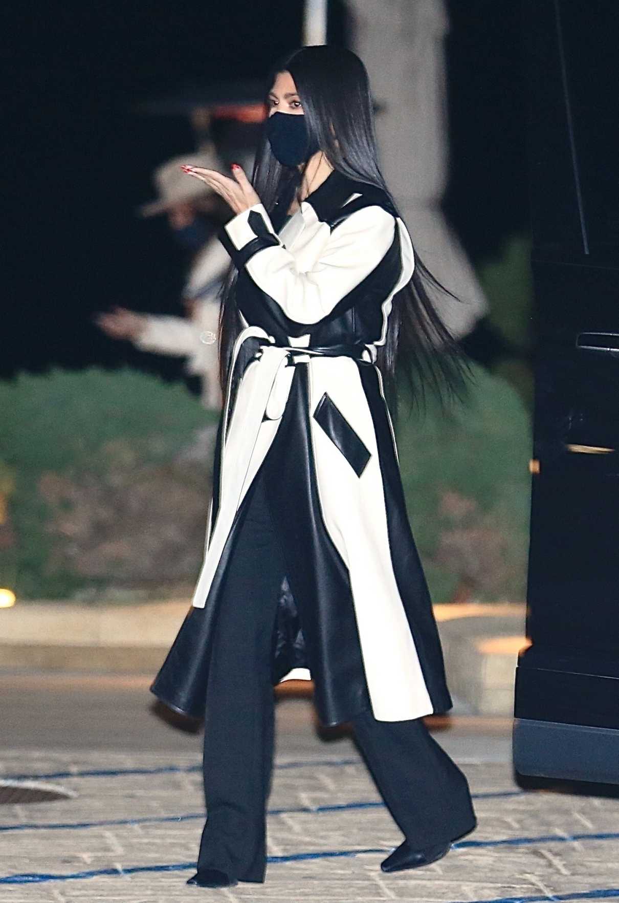 Kourtney Kardashian in a Black and White Leather Coat