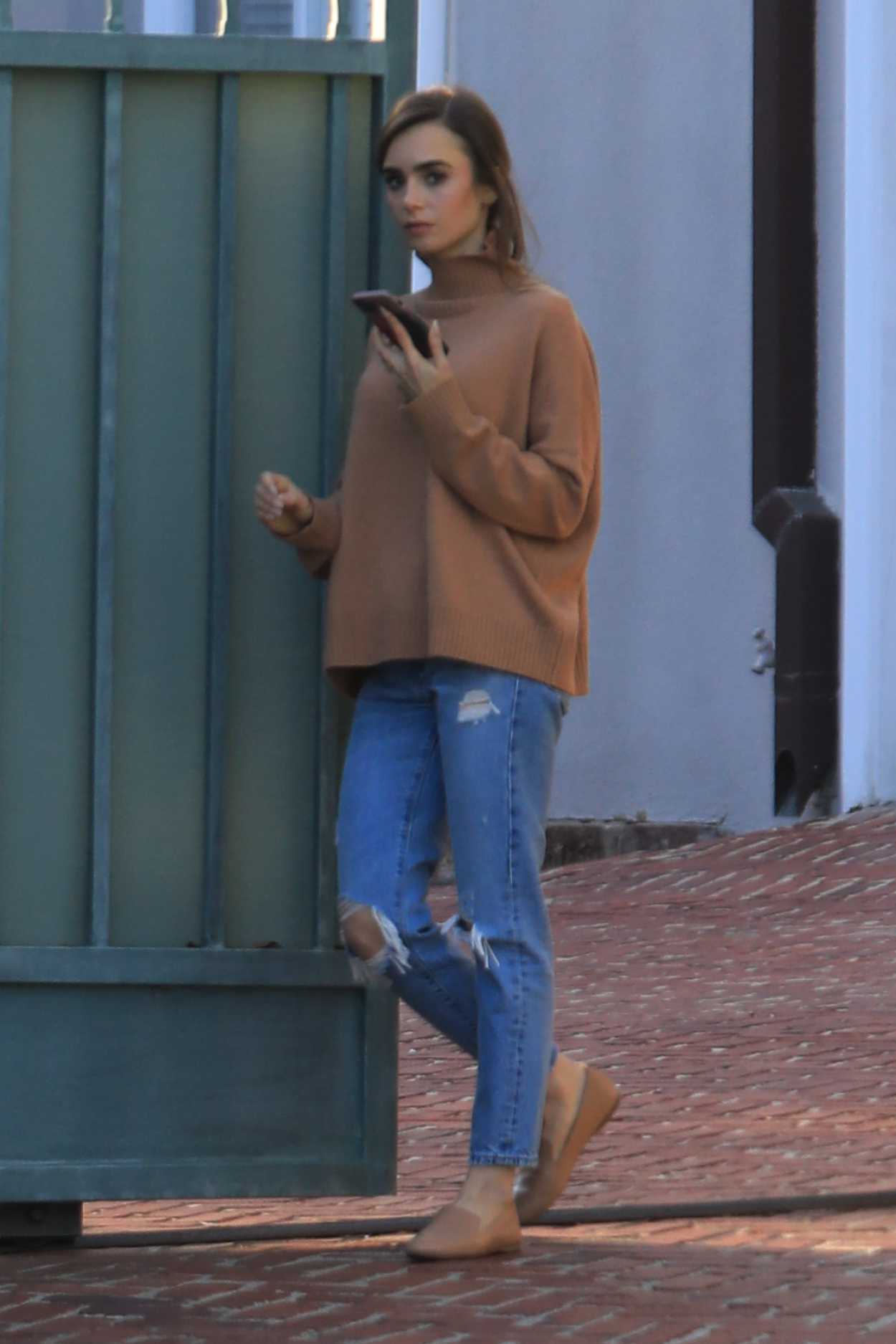 Lily Collins in a Blue Ripped Jeans Was Seen Out in Beverly Hills 02/04