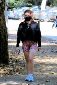Lucy Hale in a Pink Animal Print Spandex Shorts