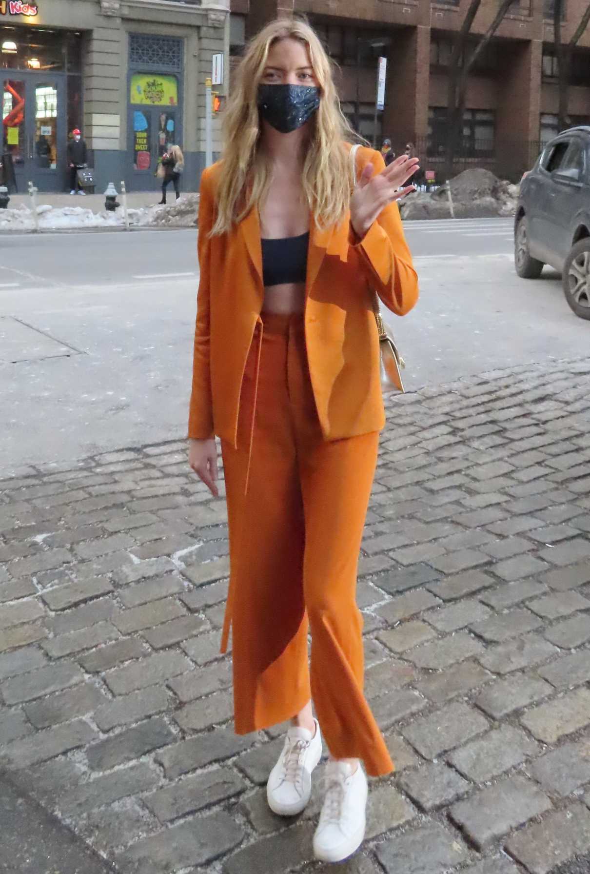 Martha Hunt in an Orange Suit