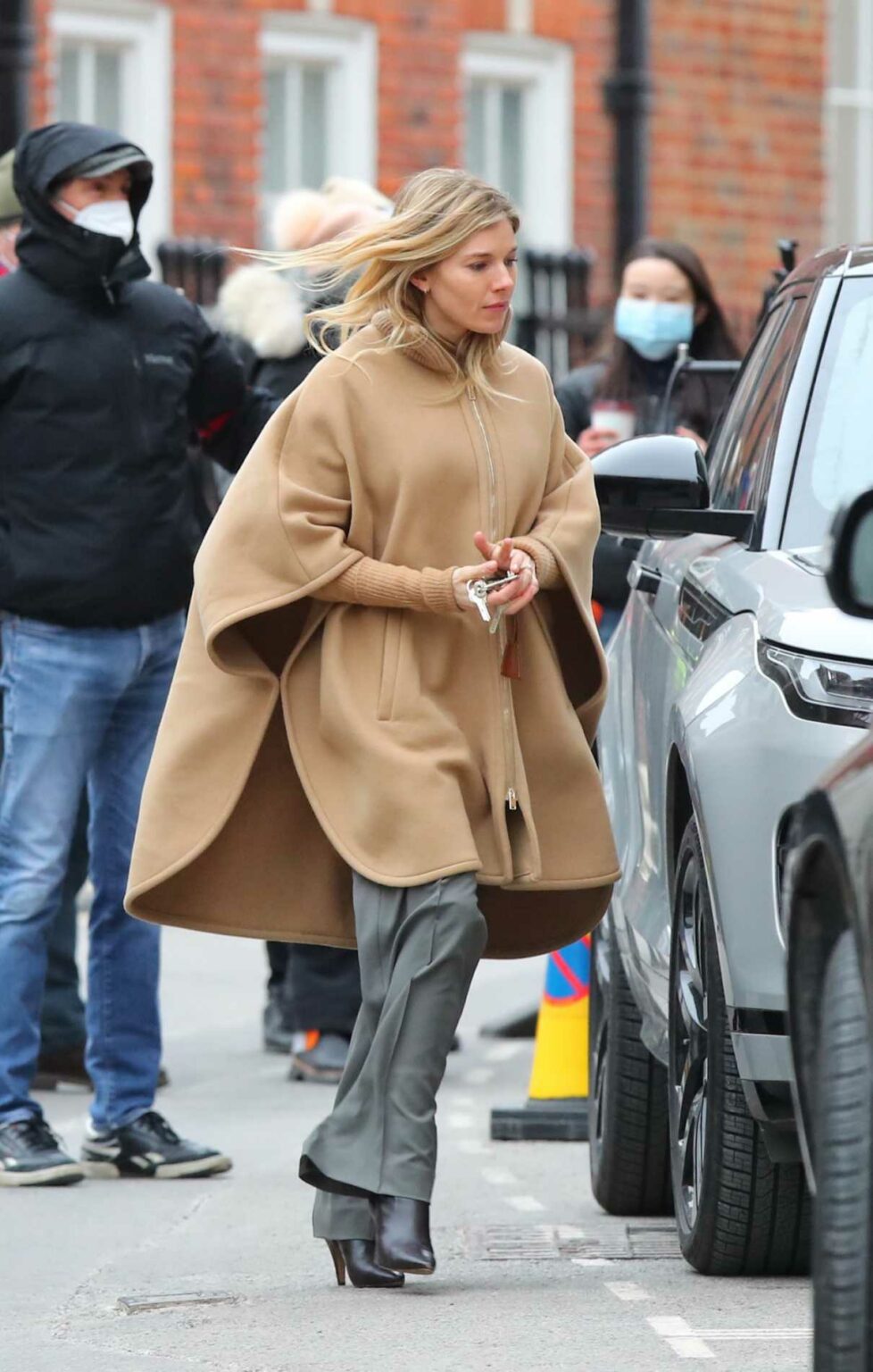 Sienna Miller in a Beige Coat on the Set of Anatomy of a Scandal in