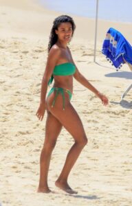 Tina Kunakey in a Green Bikini