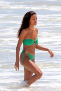 Tina Kunakey in a Green Bikini