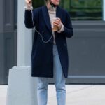 Annie Murphy in a Blue Coat Takes a Video Call while Out in New York City 03/21/2021