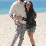 Brian Austin Green in a Beige Sweater Enjoys a Fun Day Out with Soleil Moon Frye on the Beach in Malibu 03/22/2021