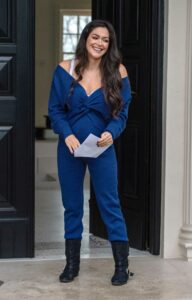 Casey Batchelor in a Blue Outfit
