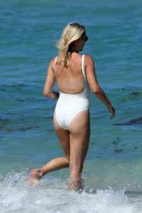 Claire Holt in a White Swimsuit