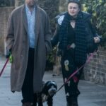 Helena Bonham Carter in a Black Puffer Jacket Walks Her Dogs Out with Rye Dag Holmboe in North London 03/21/2021