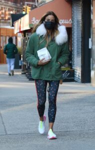 Kelly Bensimon in a Green Jacket