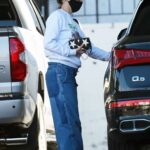 Lena Headey in a Black Protective Mask Pumps Gas Into Her Luxury SUV in Los Angeles 03/17/2021