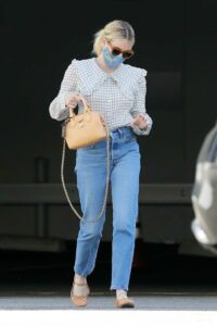 Emma Roberts in a Blue Protective Mask