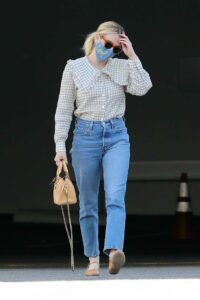 Emma Roberts in a Blue Protective Mask