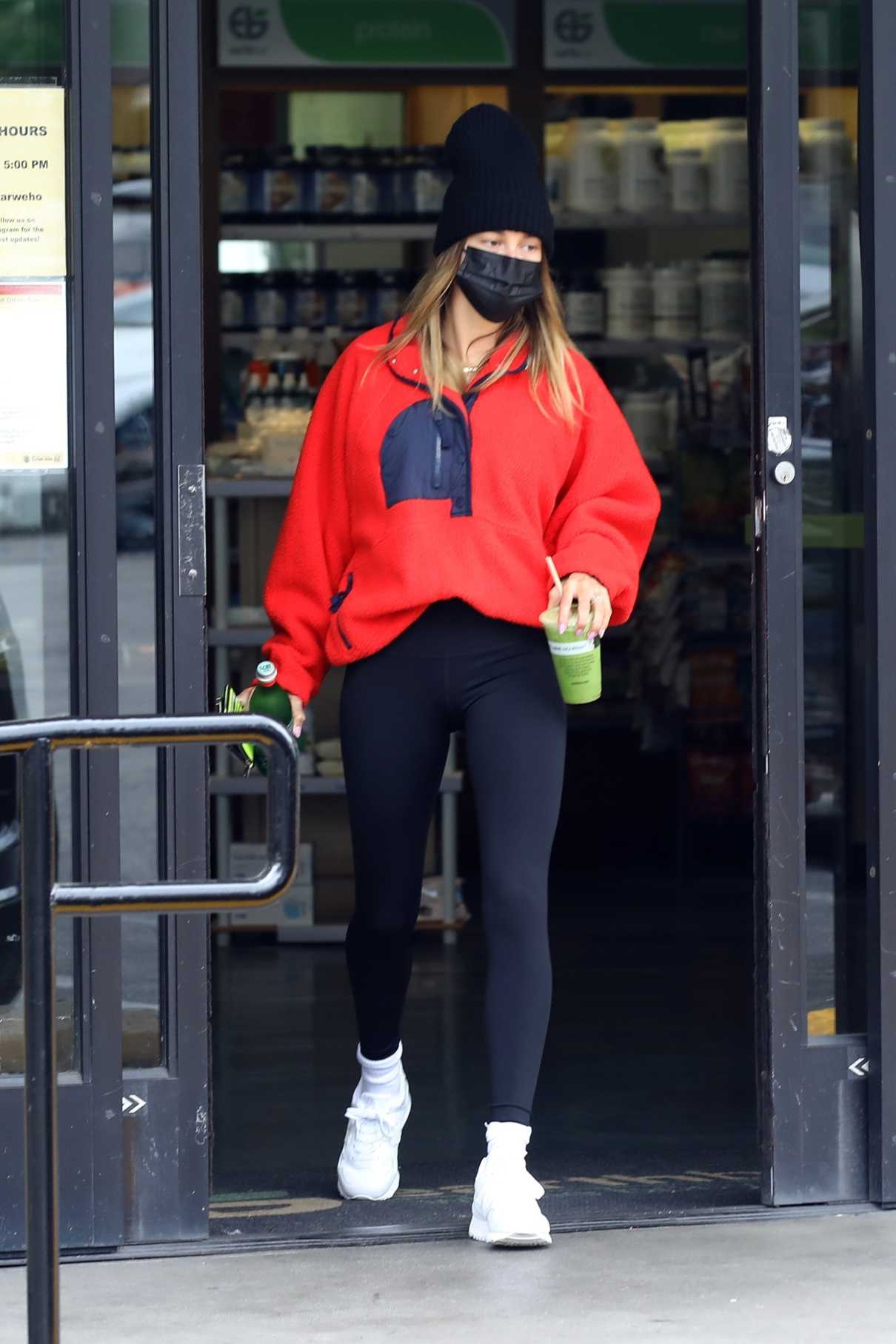 Hailey Bieber in a Red Sweatshirt Leaves the Earth Bar in West ...