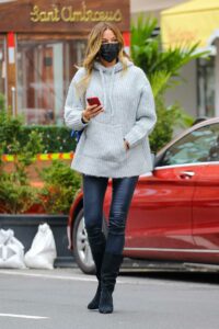 Kelly Bensimon in a Grey Knit Hoodie