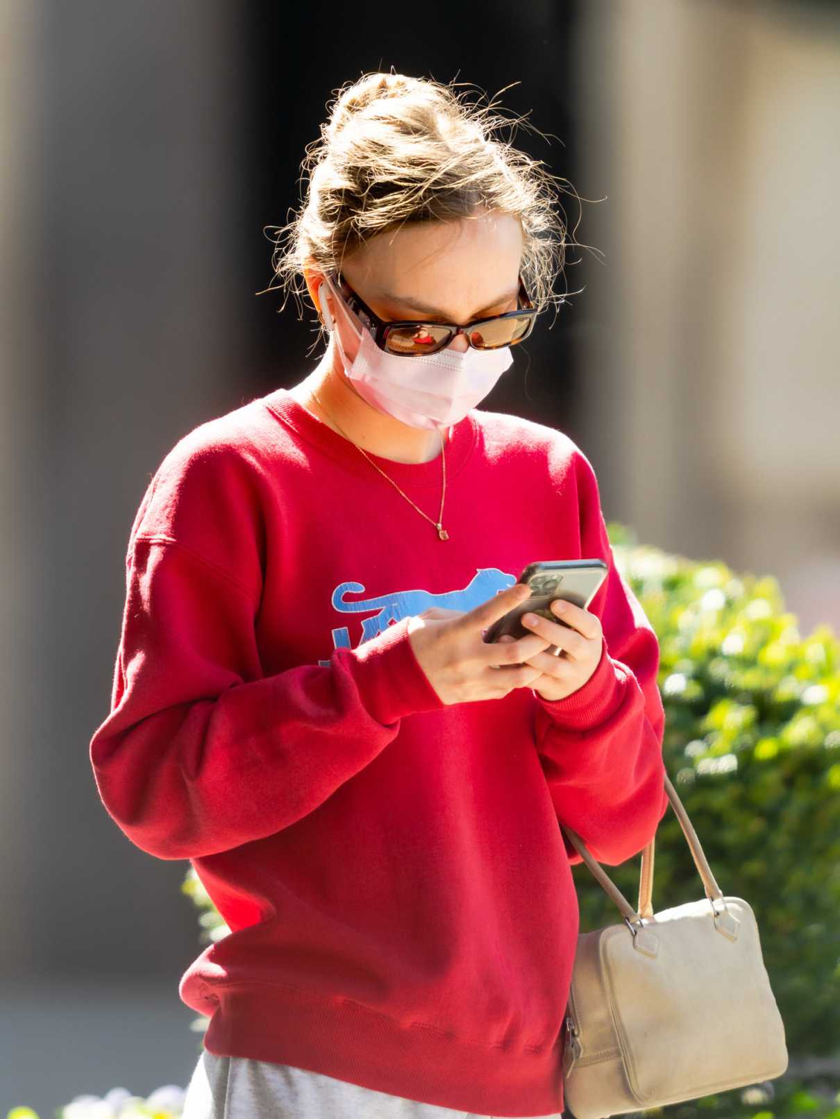Lily-Rose Depp in a Red Sweatshirt
