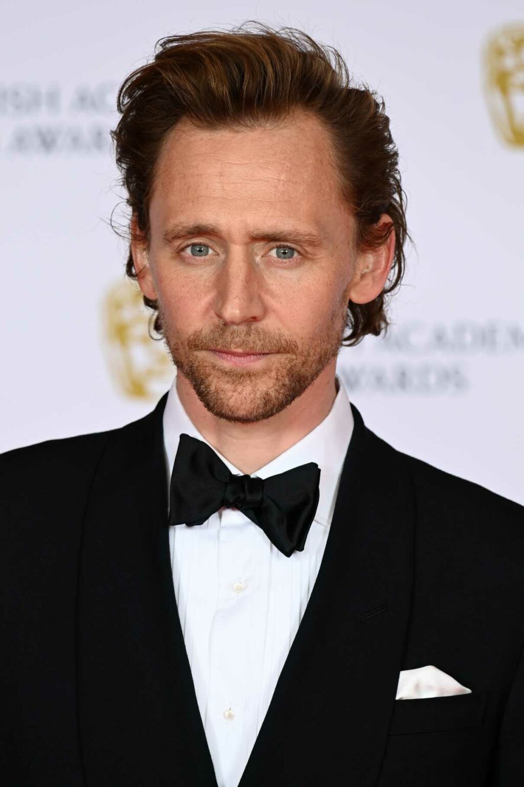 Tom Hiddleston Attends 2021 EE British Academy Film Awards at Royal