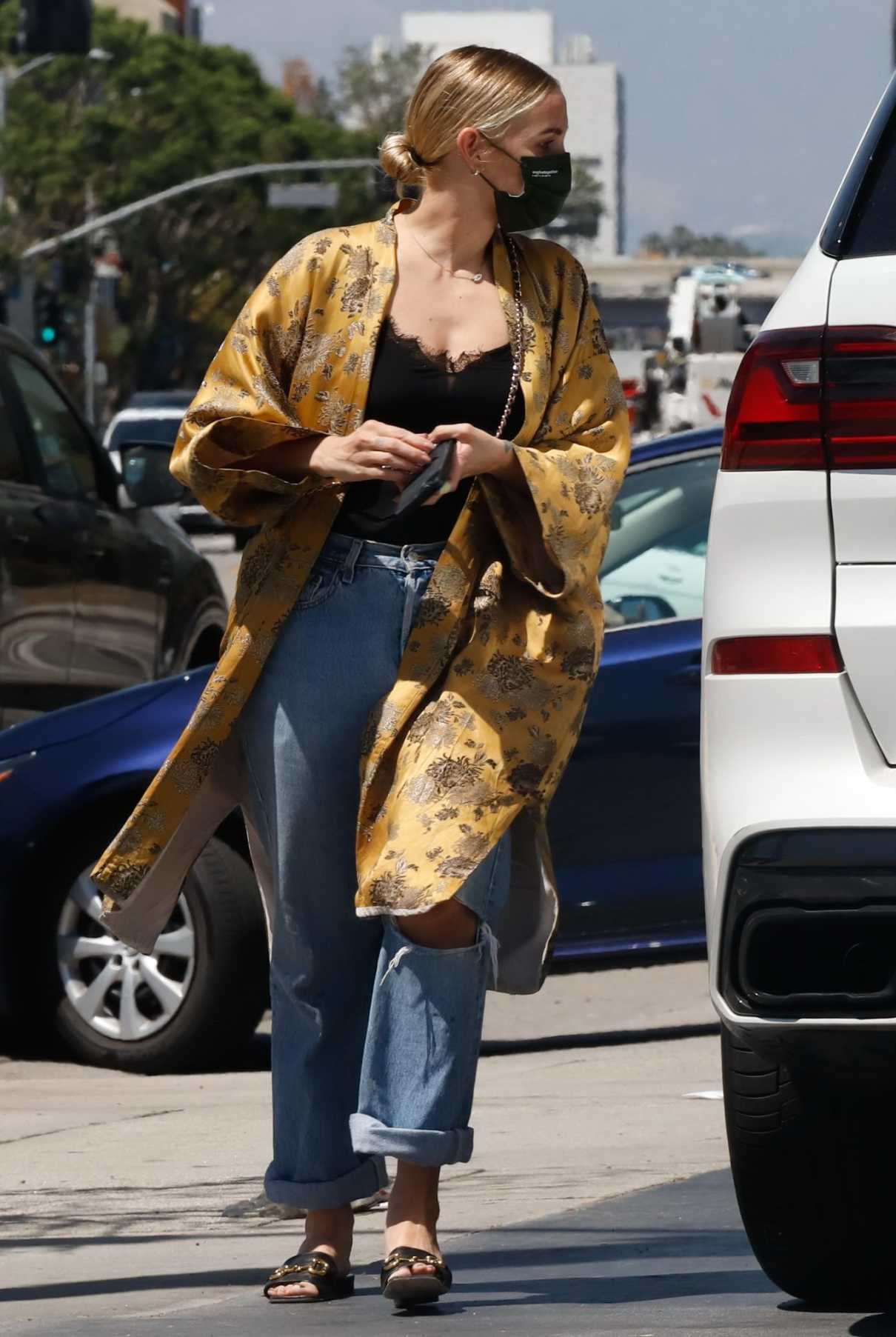 Ashlee Simpson in a Gold Cardigan