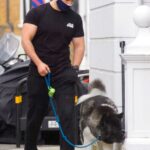 Henry Cavill in a Black Tee Walks His Dog in London 05/12/2021