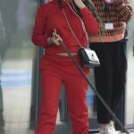 Katie Price in a Red Sweatsuit Walks Her Dog in Leeds 05/12/2021
