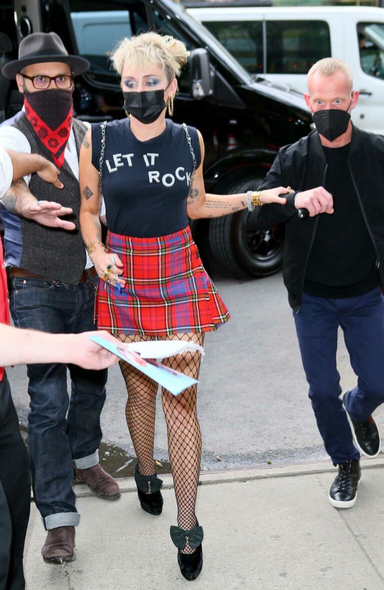 Miley Cyrus in a Red Plaid Mini Skirt Returns to Her Hotel After