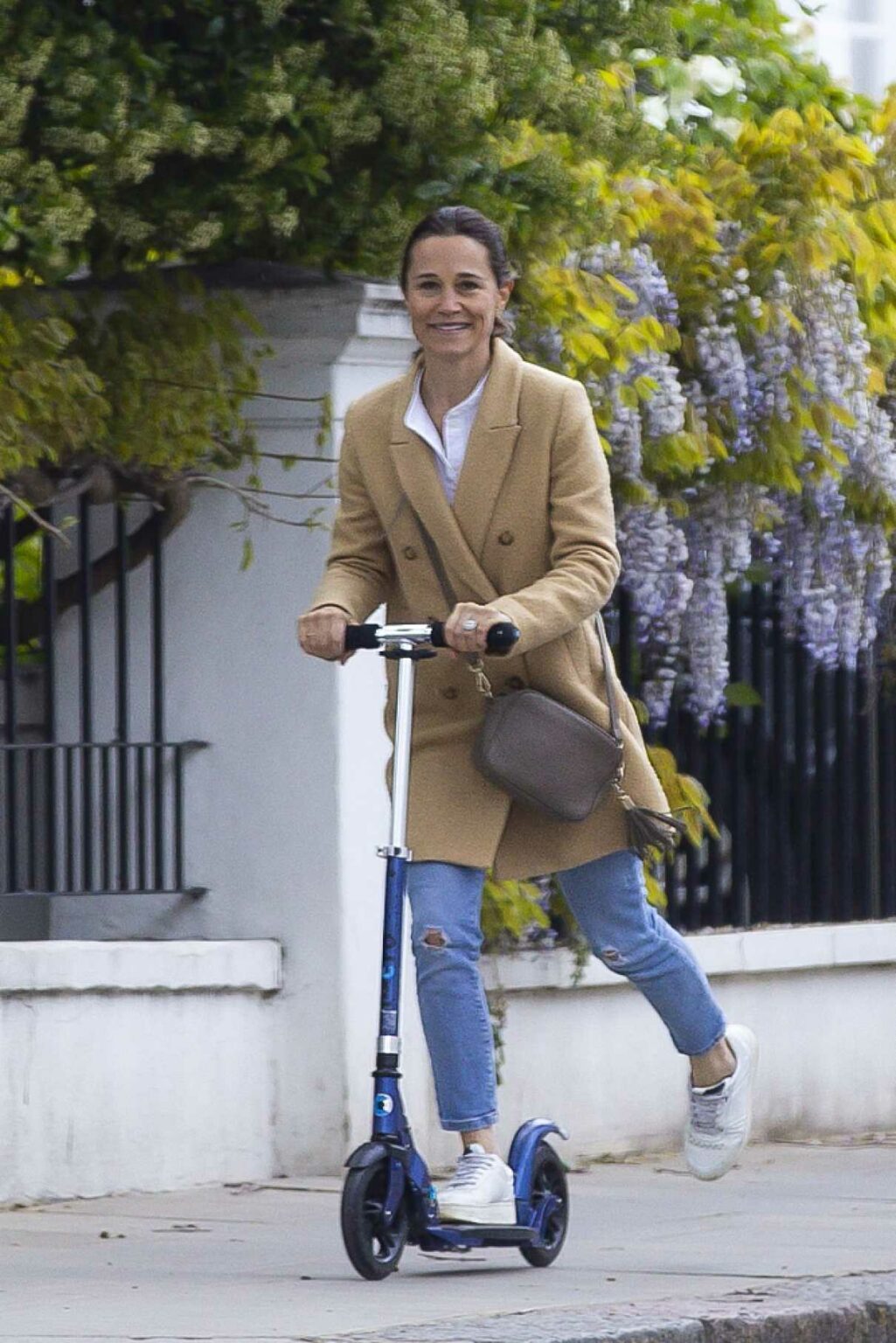 Pippa Middleton in a Beige Coat Enjoys a Scooter Ride on the Streets of