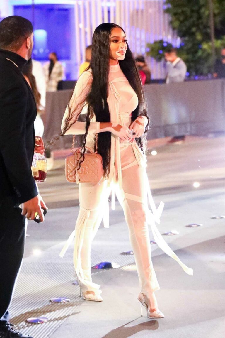 Winnie Harlow in a White Outfit Leaves Drake’s Billboard After-Party at