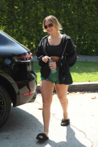 Addison Rae in a Green Spandex Shorts