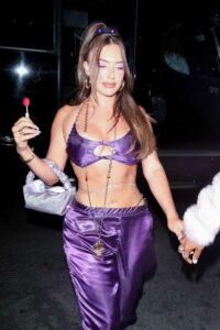 Anastasia Karanikolaou in a Purple Ensemble