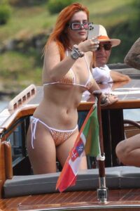 Bella Thorne in an Orange Bikini