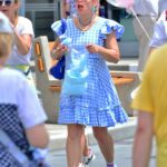 Busy Philipps in a Blue Checked Dress Enjoys Her Day with Family at Disney World in Florida 06/22/2021