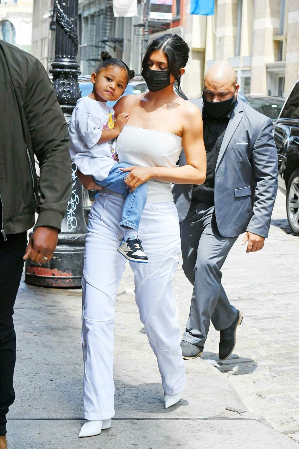 Kylie Jenner in a White Top Carries Her Daughter Stormi Out in New York