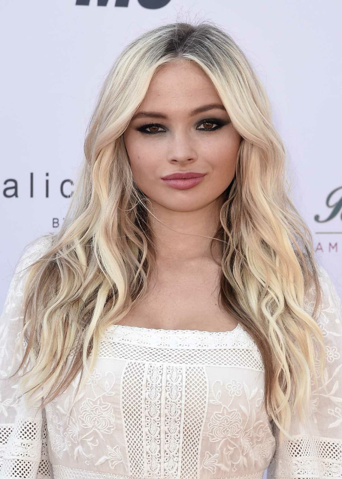Natalie Alyn Lind in a White Dress Attends the 28th Annual Race to