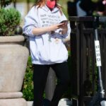 Ariel Winter in a Red Protective Mask Checks Her Phone Out in Los Angeles 07/23/2021