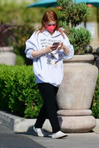 Ariel Winter in a Red Protective Mask