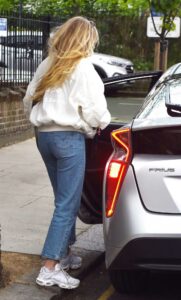 Clara Paget in a White Bomber Jacket