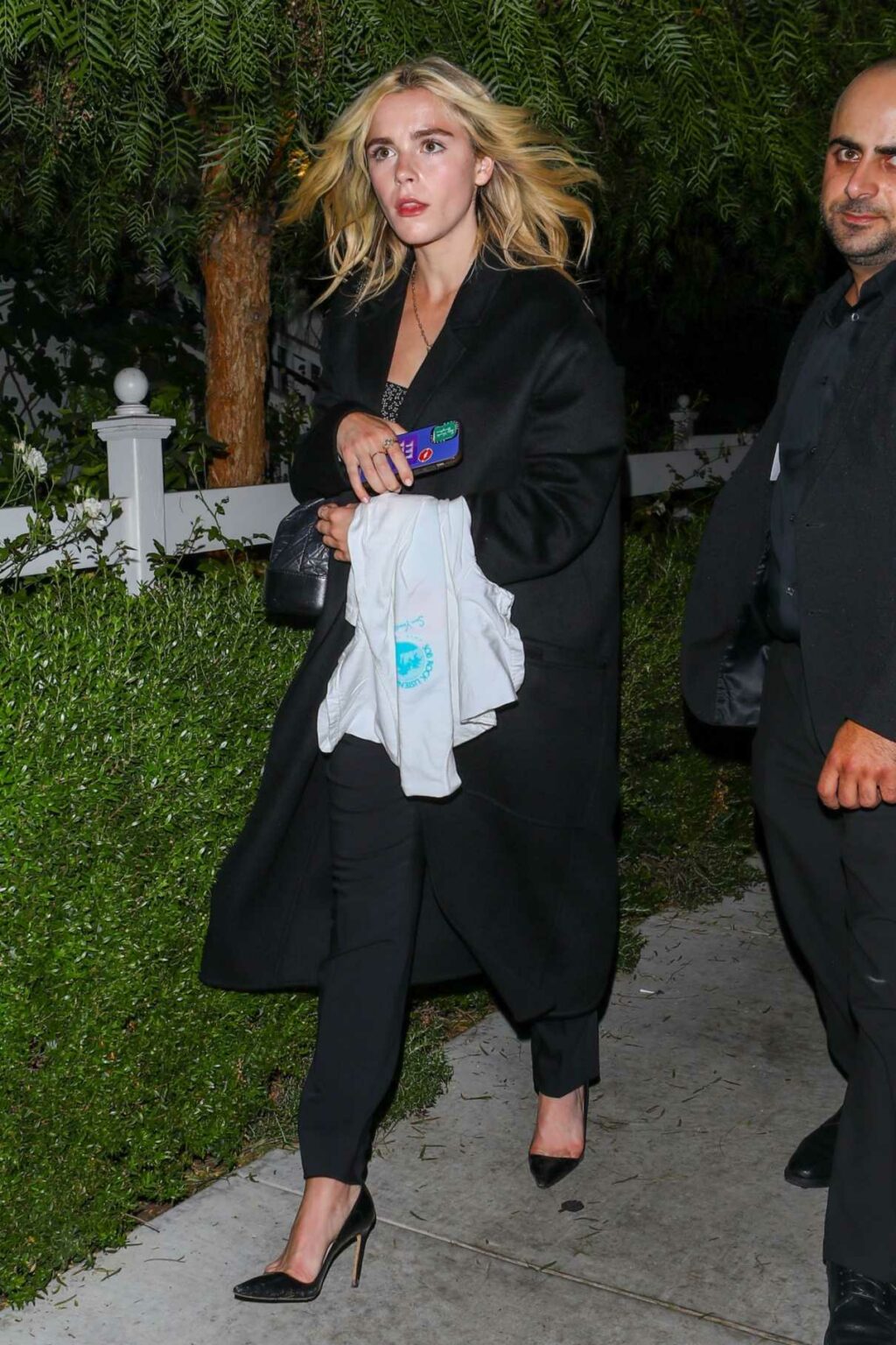 Kiernan Shipka in a Black Coat Leaves a John Mayer Album Listening