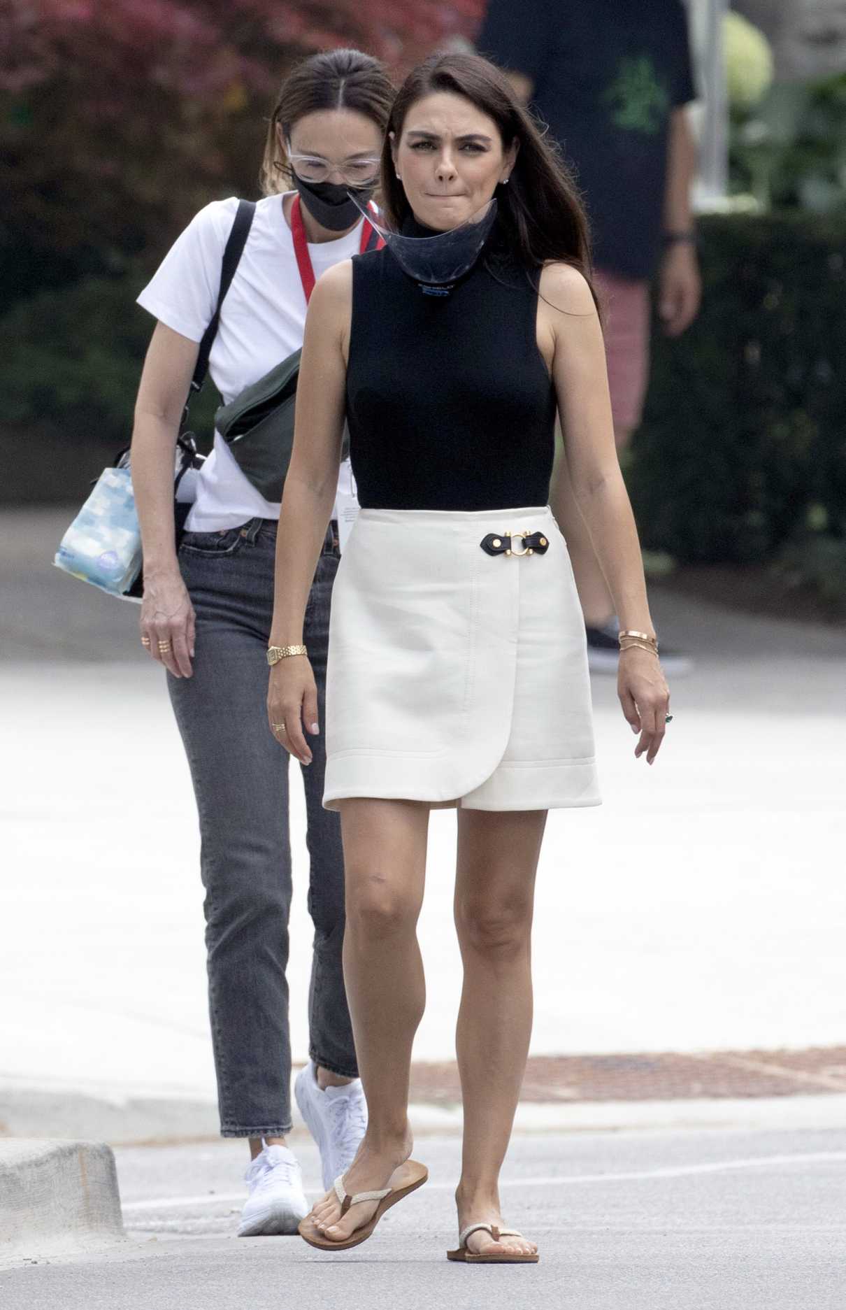Mila Kunis in a White Skirt