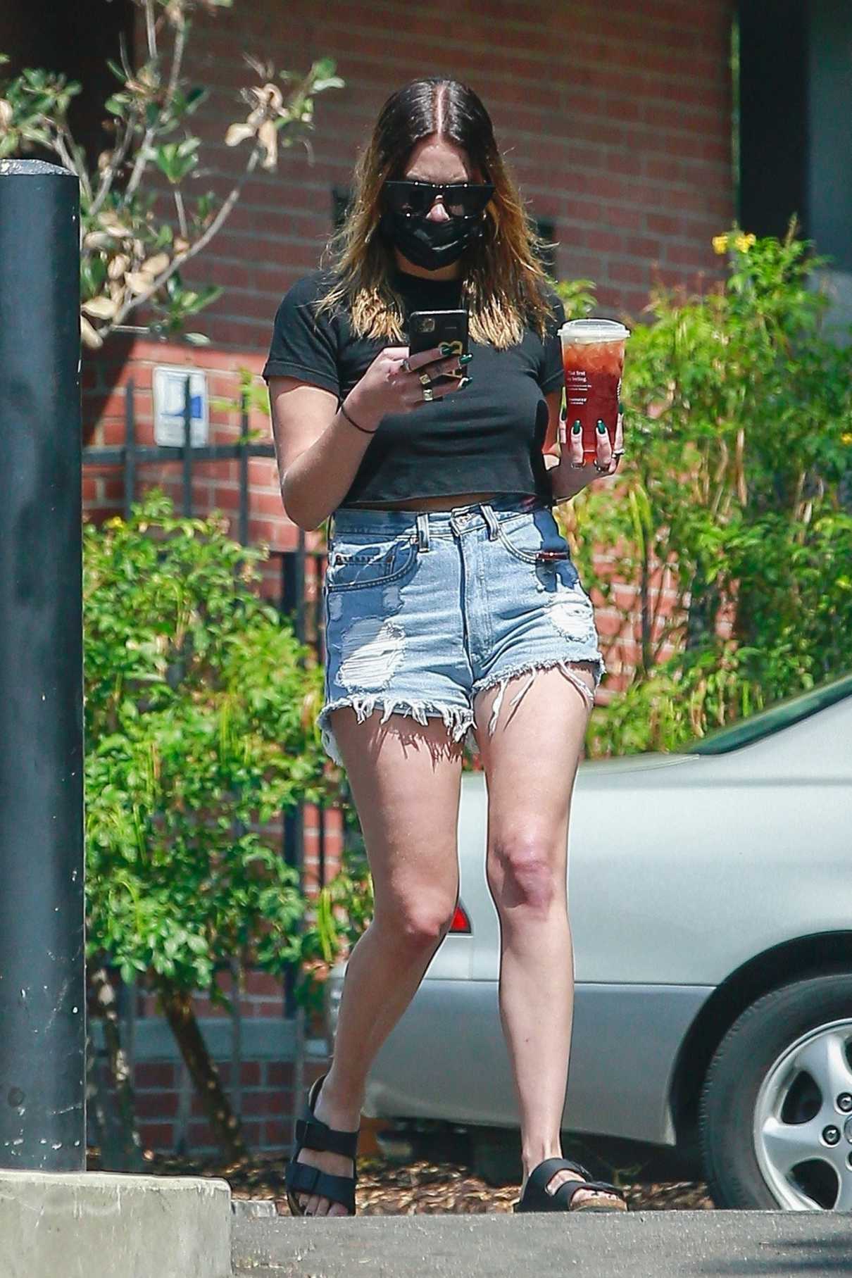 Ashley Benson in a Blue Denim Shorts