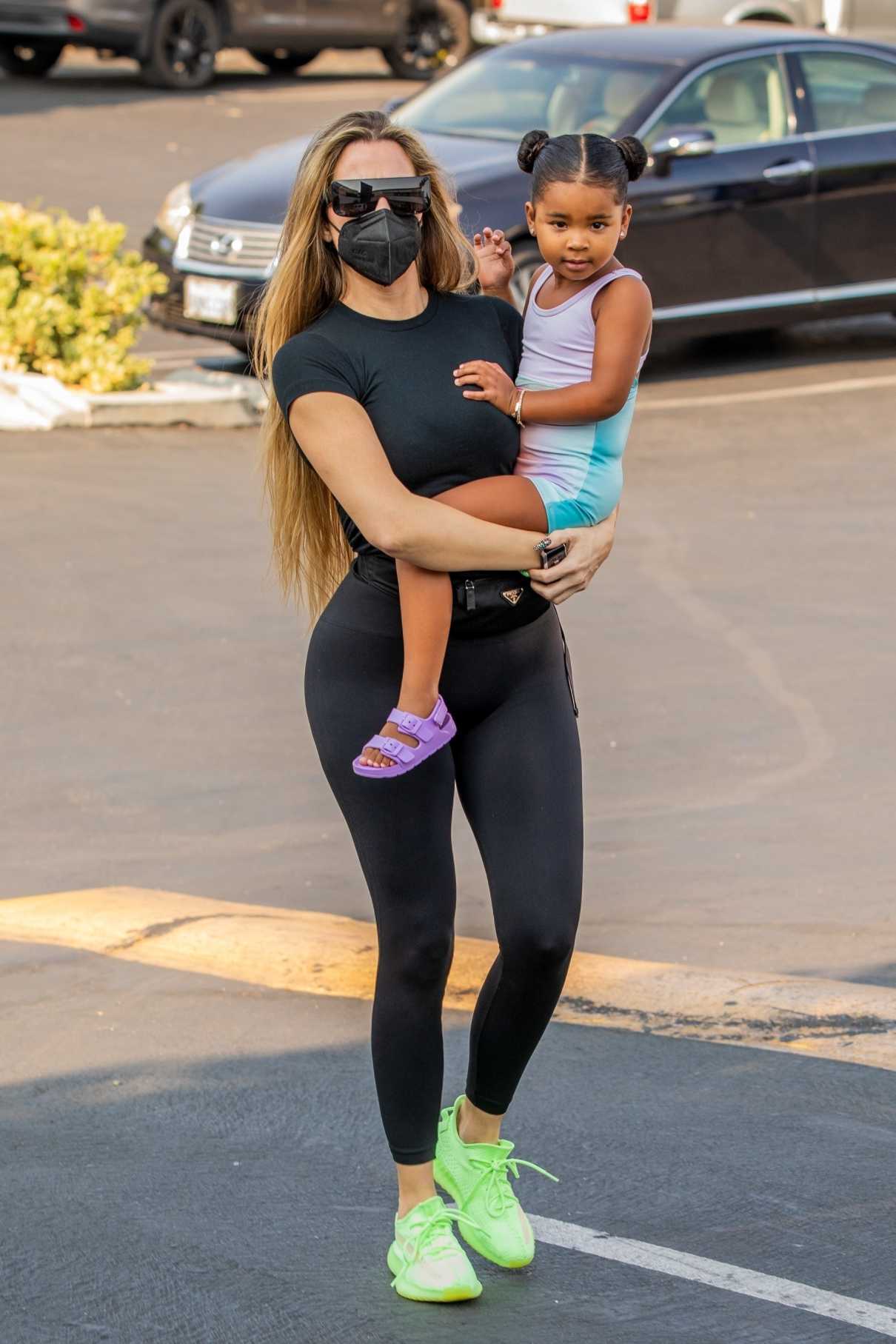 Khloe Kardashian in a Neon Green Sneakers