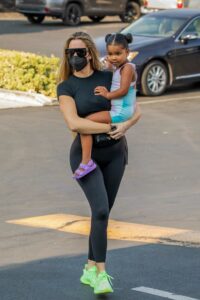 Khloe Kardashian in a Neon Green Sneakers