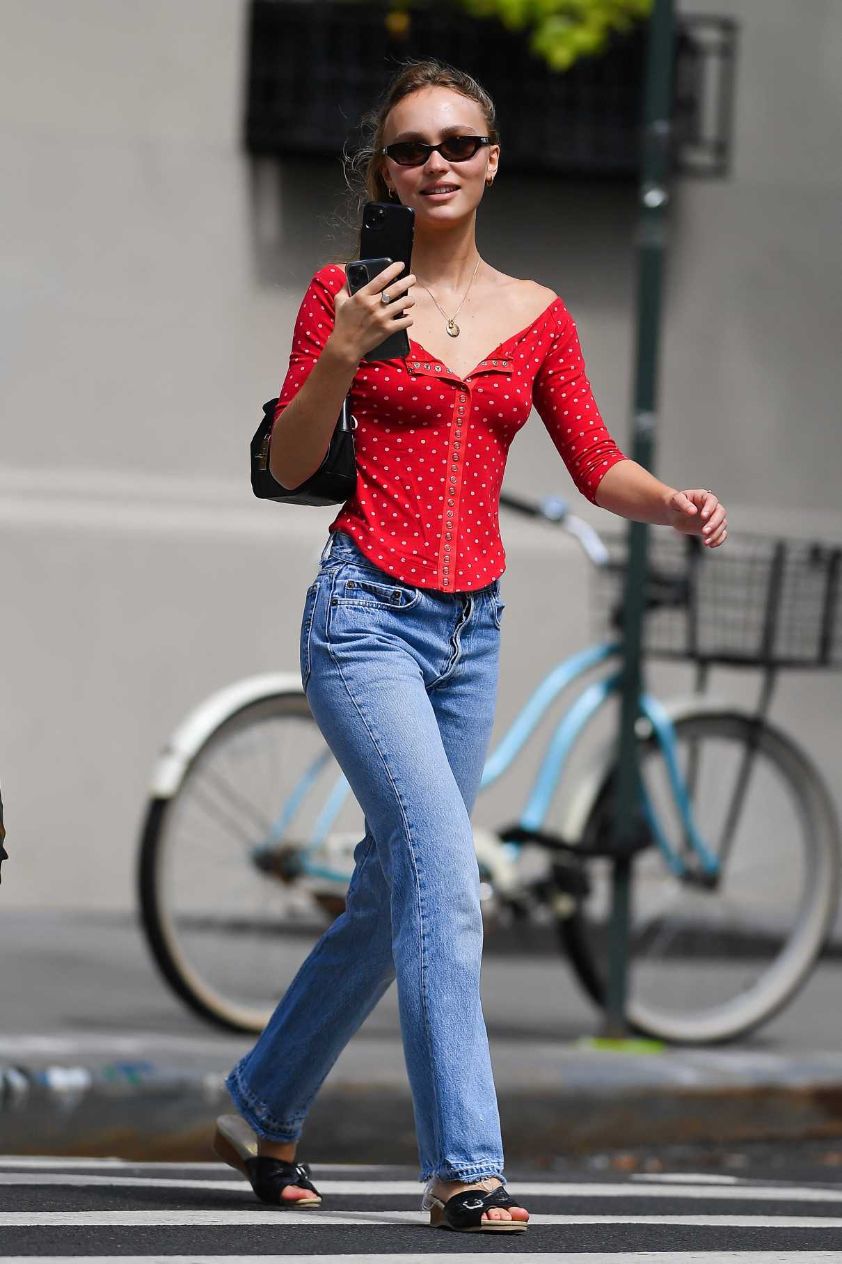 Lily-Rose Depp in a Red Polka Dot Blouse