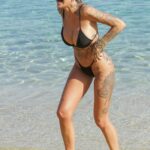 Tina Louise in a Black Bikini on the Beach in Mykonos 08/01/2021